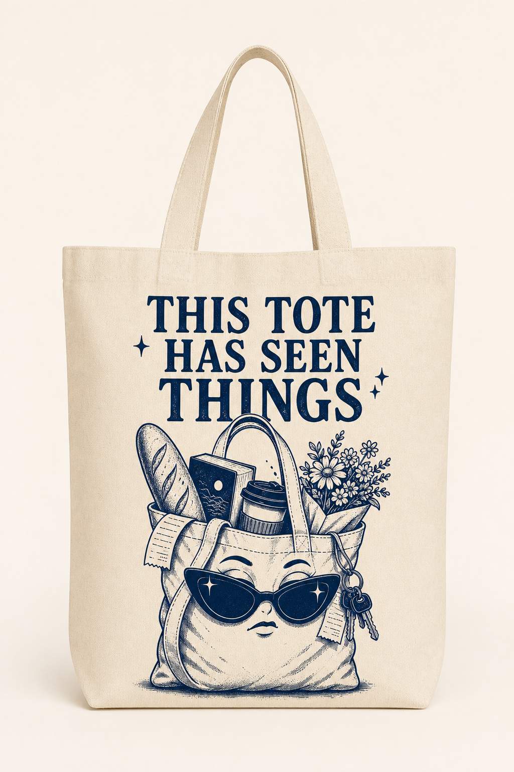 Natural canvas tote bag with a deep navy one-color print reading This Tote Has Seen Things
